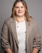 TRACEY F.