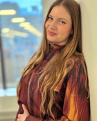 ALEXANDRA M.